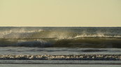 SX00685 Spray of small waving braking on Tramore beach.jpg